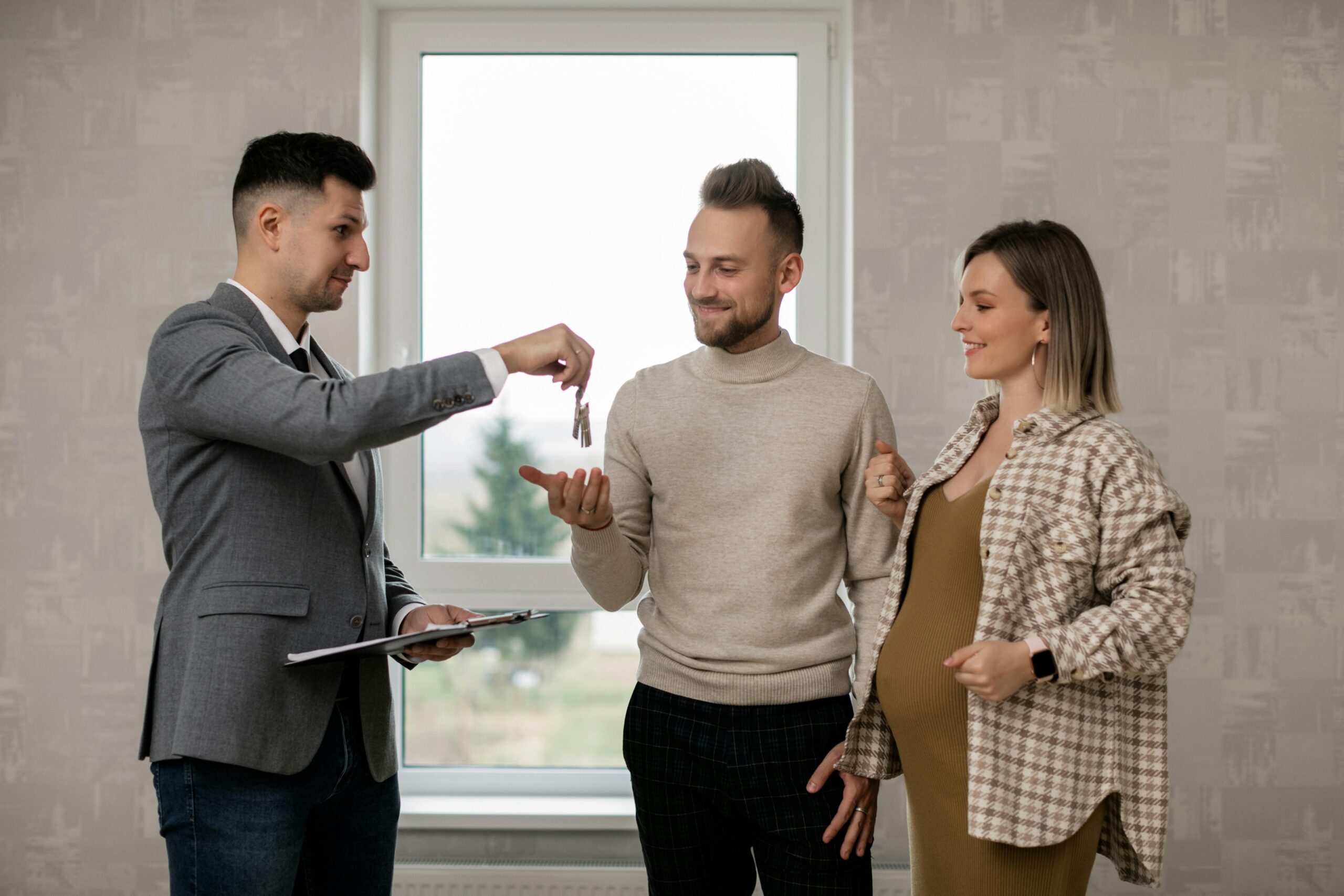 real estate agent and new homeowners